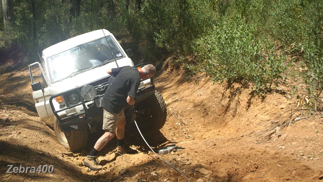 17-Duncan checks the winch cable before attempting Rhino's recovery.JPG - 17-Duncan checks the winch cable before attempting Rhino's recovery